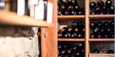 A shelf full of wine bottles