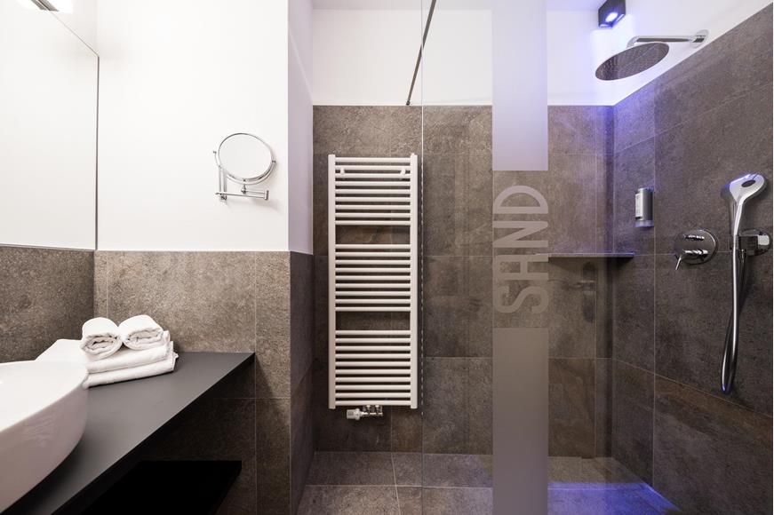 Bathroom with shower and sink